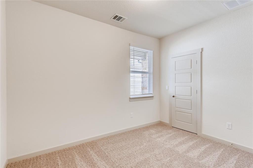 8033 Linnie Lane Austin, TX 78724 - Photo 8 of 17 an empty room with windows