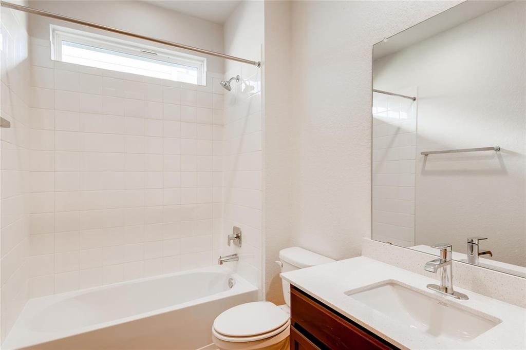 8033 Linnie Lane Austin, TX 78724 - Photo 10 of 17 a bathroom with a sink toilet and shower