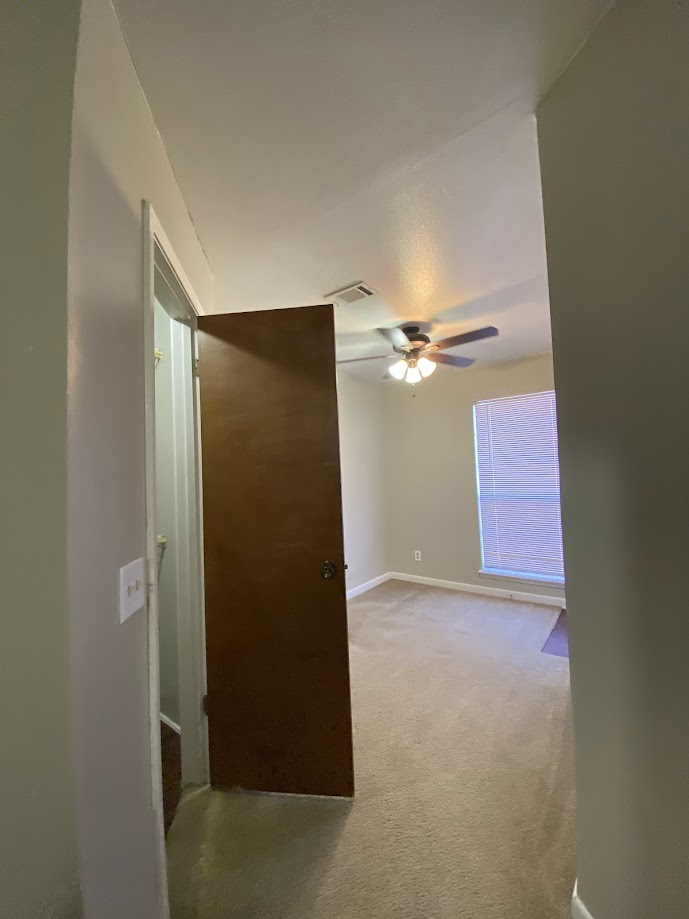 1305 West Villa Maria Road, Unit B107 Bryan, TX 77801 - Photo 13 of 17 an empty room with closet and a ceiling fan