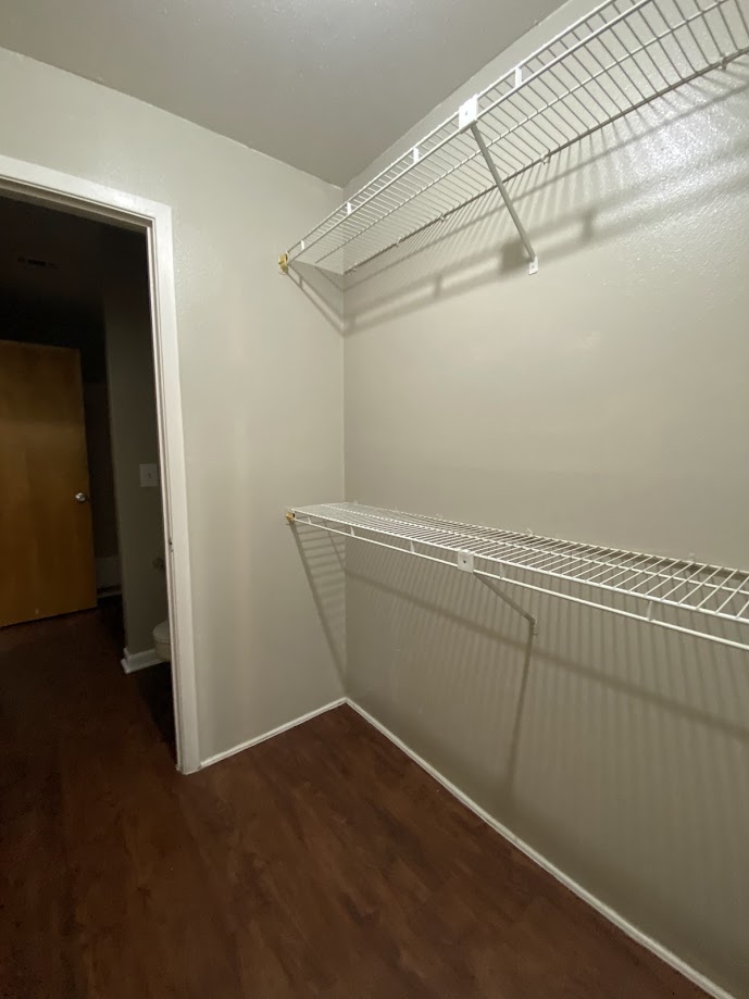 1305 West Villa Maria Road, Unit B107 Bryan, TX 77801 - Photo 14 of 17 a view of a room with racks on the wall