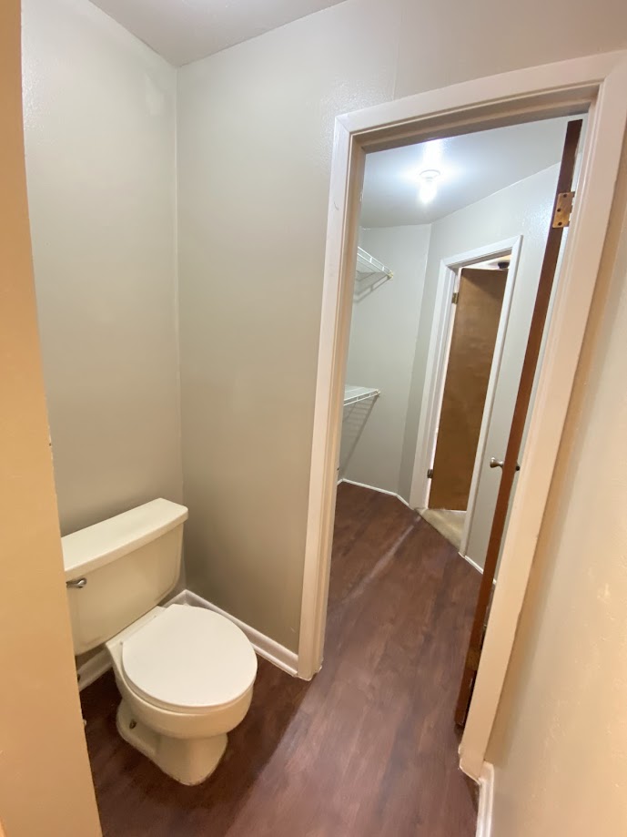 1305 West Villa Maria Road, Unit B107 Bryan, TX 77801 - Photo 15 of 17 a white toilet sitting next to a sink