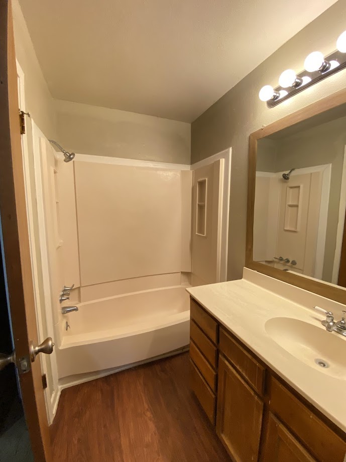 1305 West Villa Maria Road, Unit B107 Bryan, TX 77801 - Photo 16 of 17 a bathroom with a bathtub and a sink