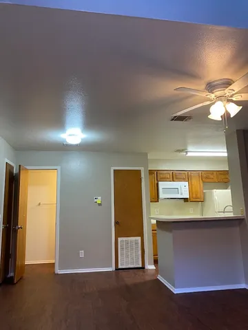 an empty room with a empty space and a window