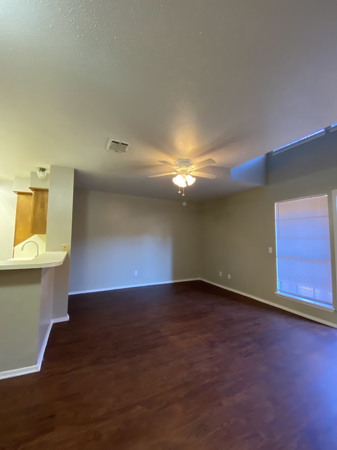 1305 West Villa Maria Road, Unit B107 Bryan, TX 77801 - Photo 5 of 17 an empty room with a empty space and a window