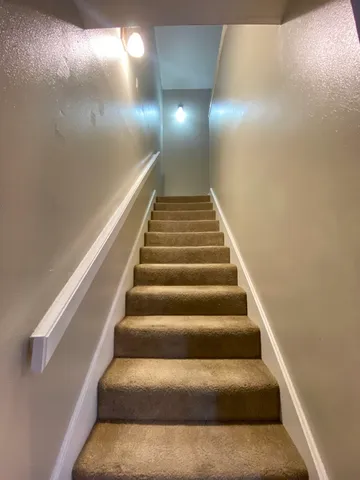 an empty room with a empty space and windows