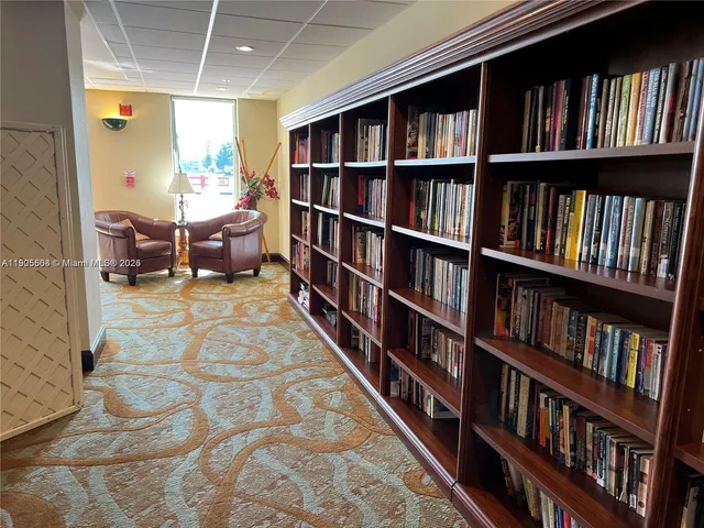 a living room with lots of books