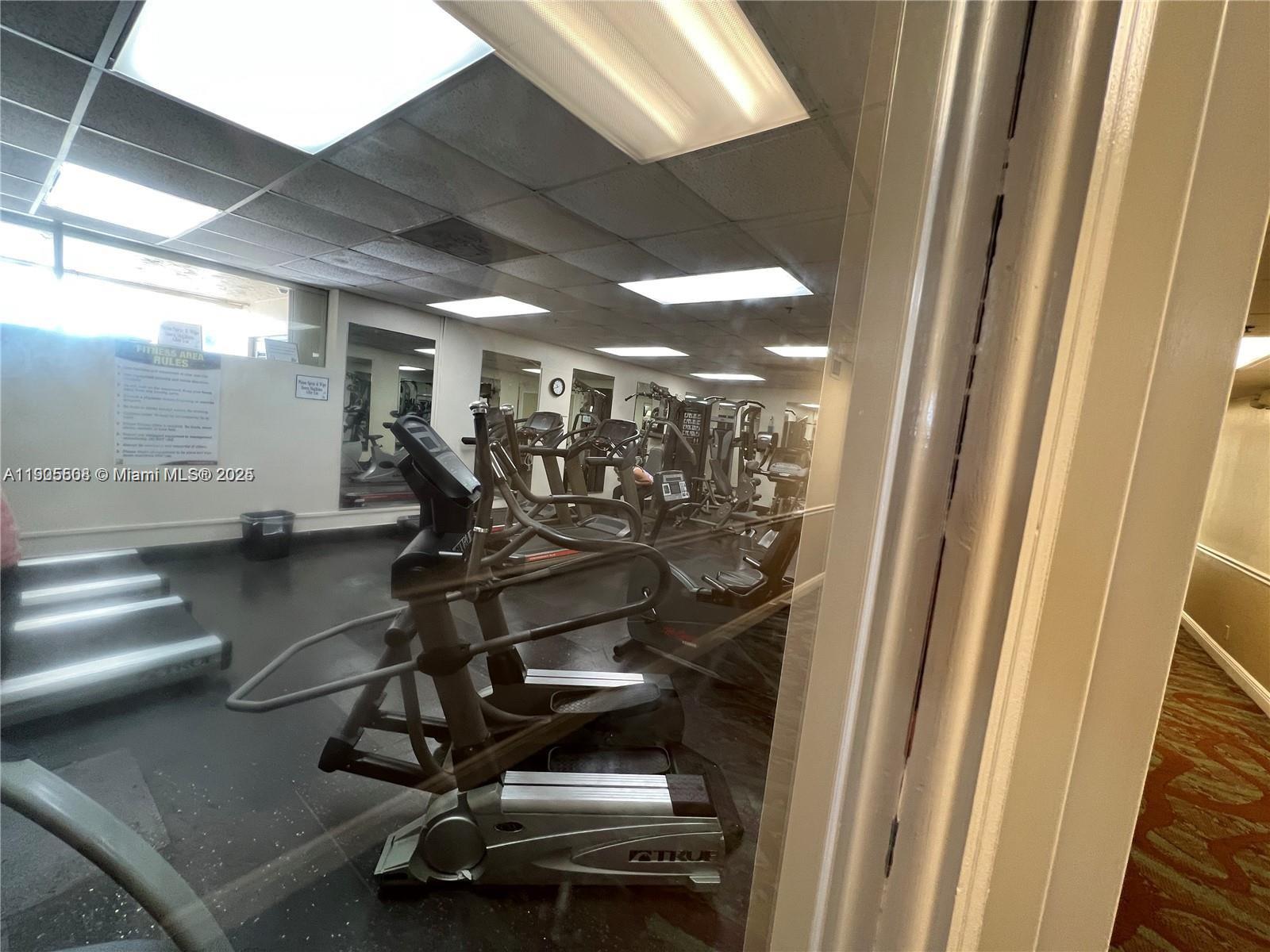 1830 Sabal Palm Drive, Unit 406 Davie, FL 33324 - Photo 15 of 16 a view of a room with gym equipment