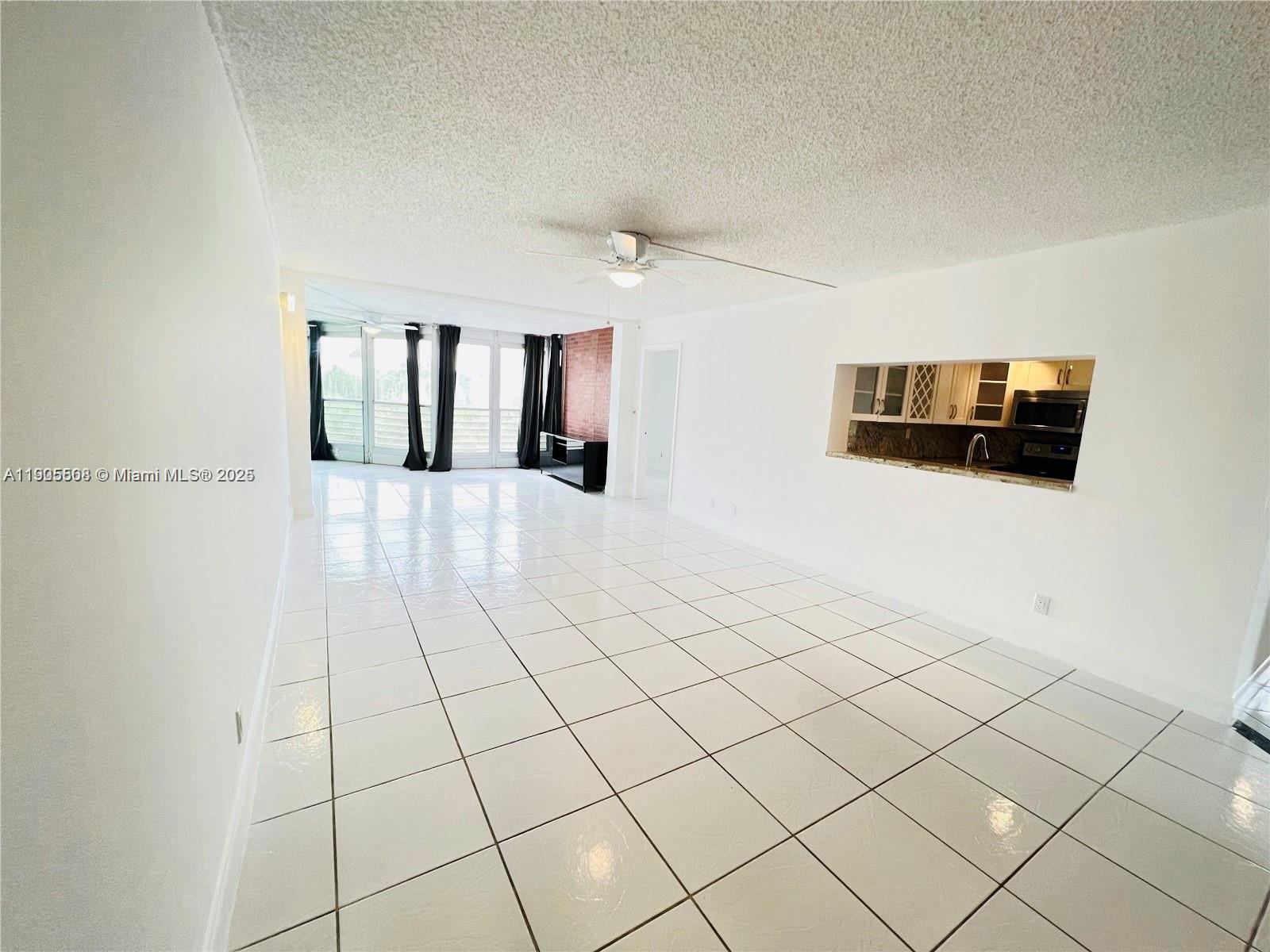 1830 Sabal Palm Drive, Unit 406 Davie, FL 33324 - Photo 7 of 16 a view of a livingroom with furniture