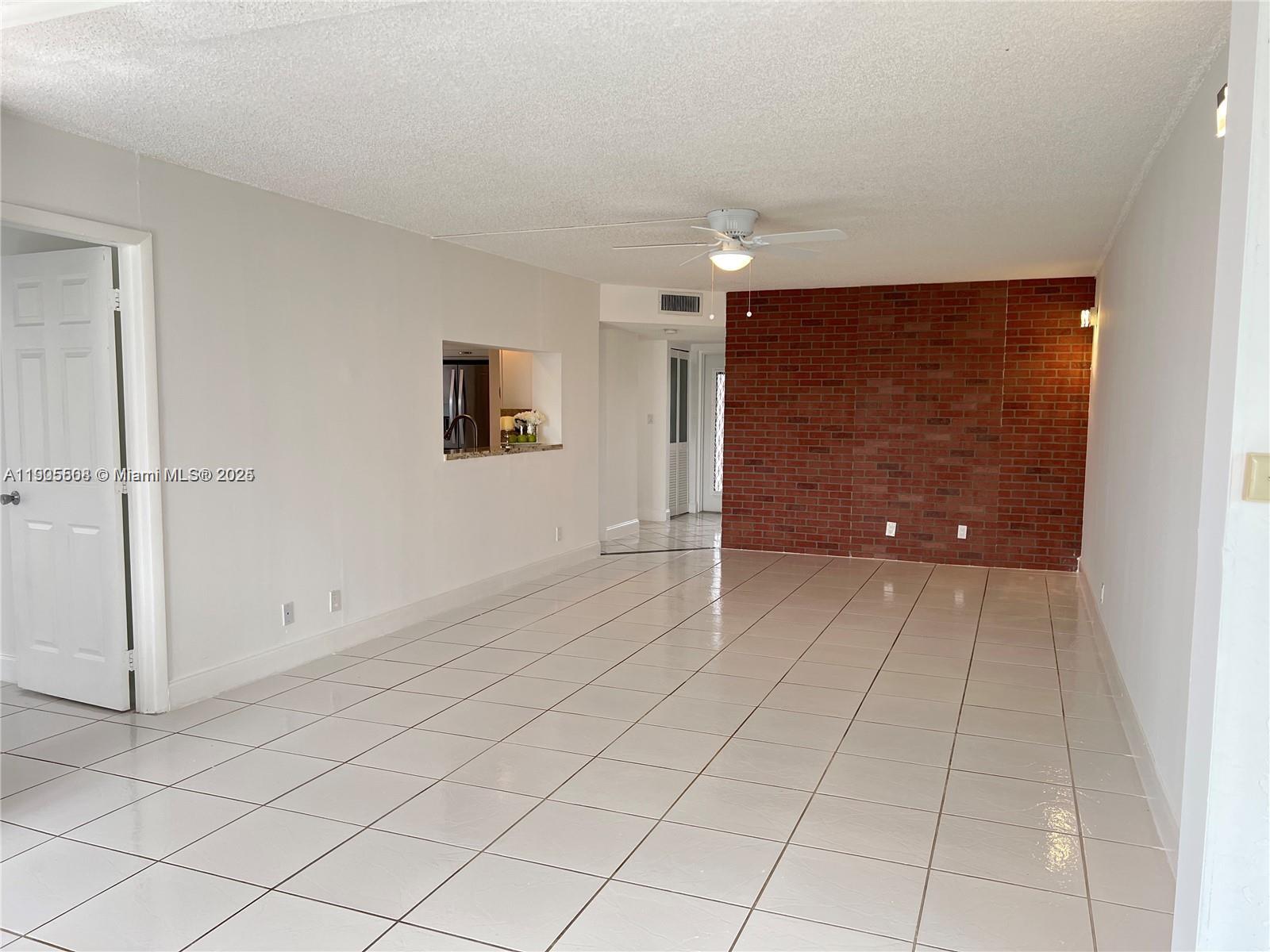 1830 Sabal Palm Drive, Unit 406 Davie, FL 33324 - Photo 8 of 16 a view of an empty room