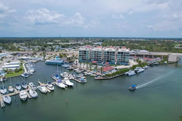 an aerial view of a houses with ocean view