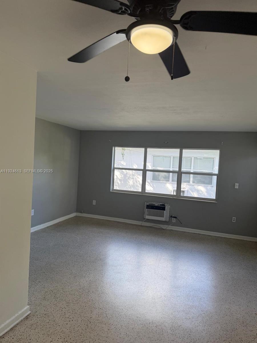 an empty room with a empty space and a window