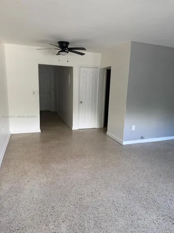 a view of a livingroom with a ceiling fan