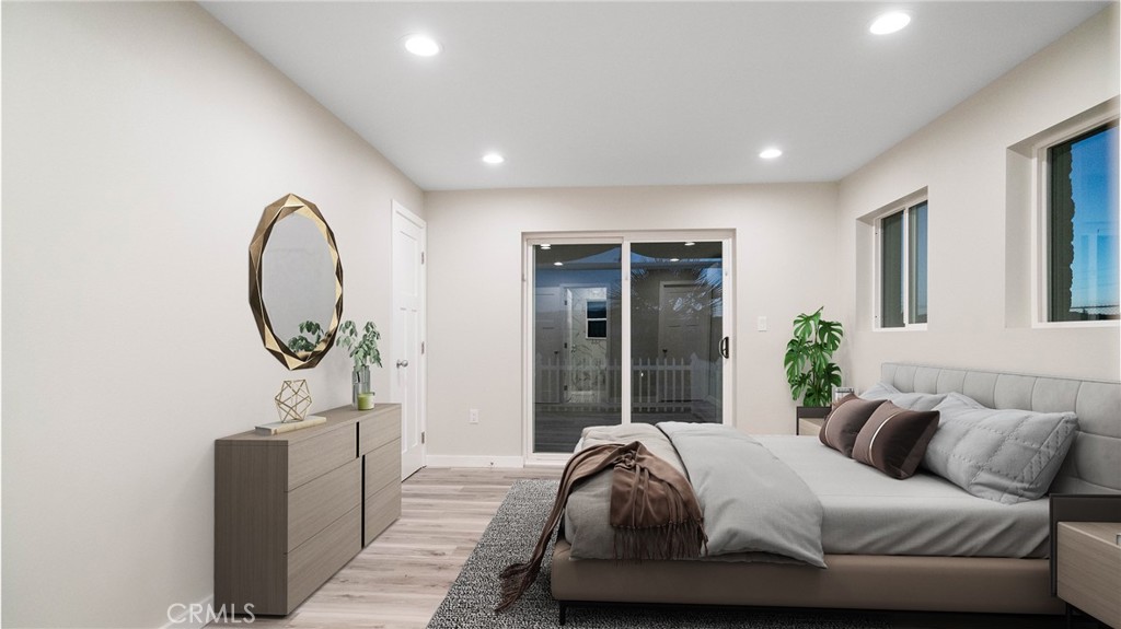 72160 Winters Road Twentynine Palms, CA 92277 - Photo 12 of 33 a bedroom with bed and a large window