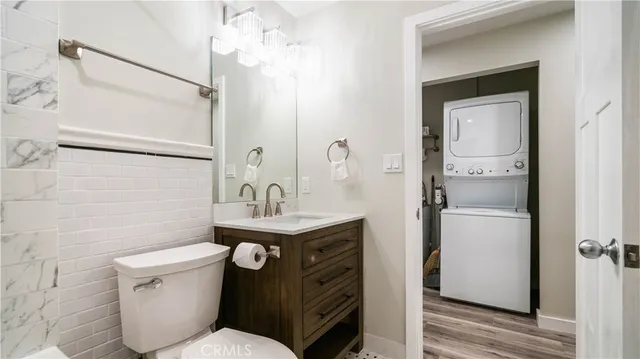 a bathroom with a toilet sink and shower