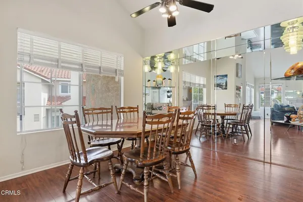 a view of a dining room with furniture window and wooden floor