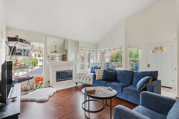 a living room with furniture and a fireplace