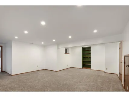 a kitchen with stainless steel appliances kitchen island sink refrigerator and stove