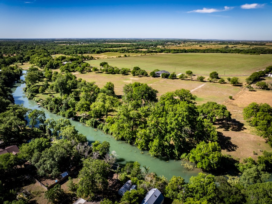 110 Rustic River Street Martindale, TX 78655 - Photo 20 of 28 Overview of rural landscape with a nearby body of water