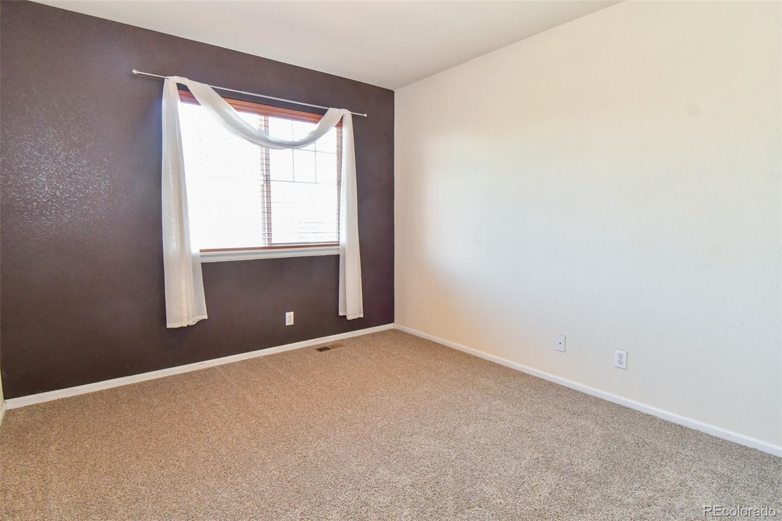 3978 Balderas Street Brighton, CO 80601 - Photo 12 of 27 an empty room with a window