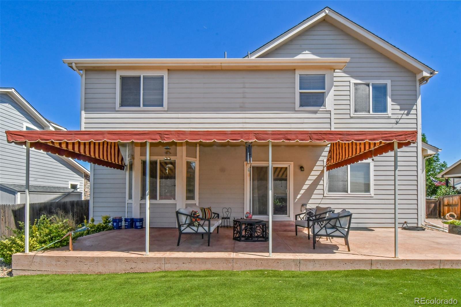 3978 Balderas Street Brighton, CO 80601 - Photo 24 of 27 a front view of house with yard and outdoor seating