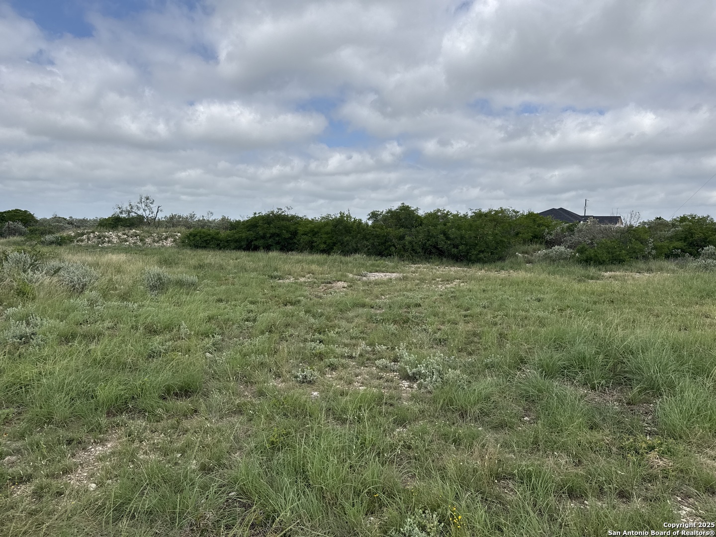 21 Legend Hills Uvalde, TX 78801 - Photo 3 of 6 a view of a lake with houses in the back