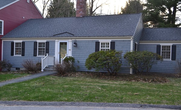 102 Jericho Road, Unit 102 Weston, MA 02493 - Photo 1 of 9 a view of a house with a yard plants and large tree