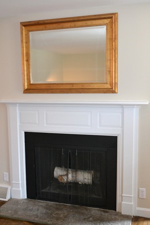 102 Jericho Road, Unit 102 Weston, MA 02493 - Photo 4 of 9 a living room with a fireplace