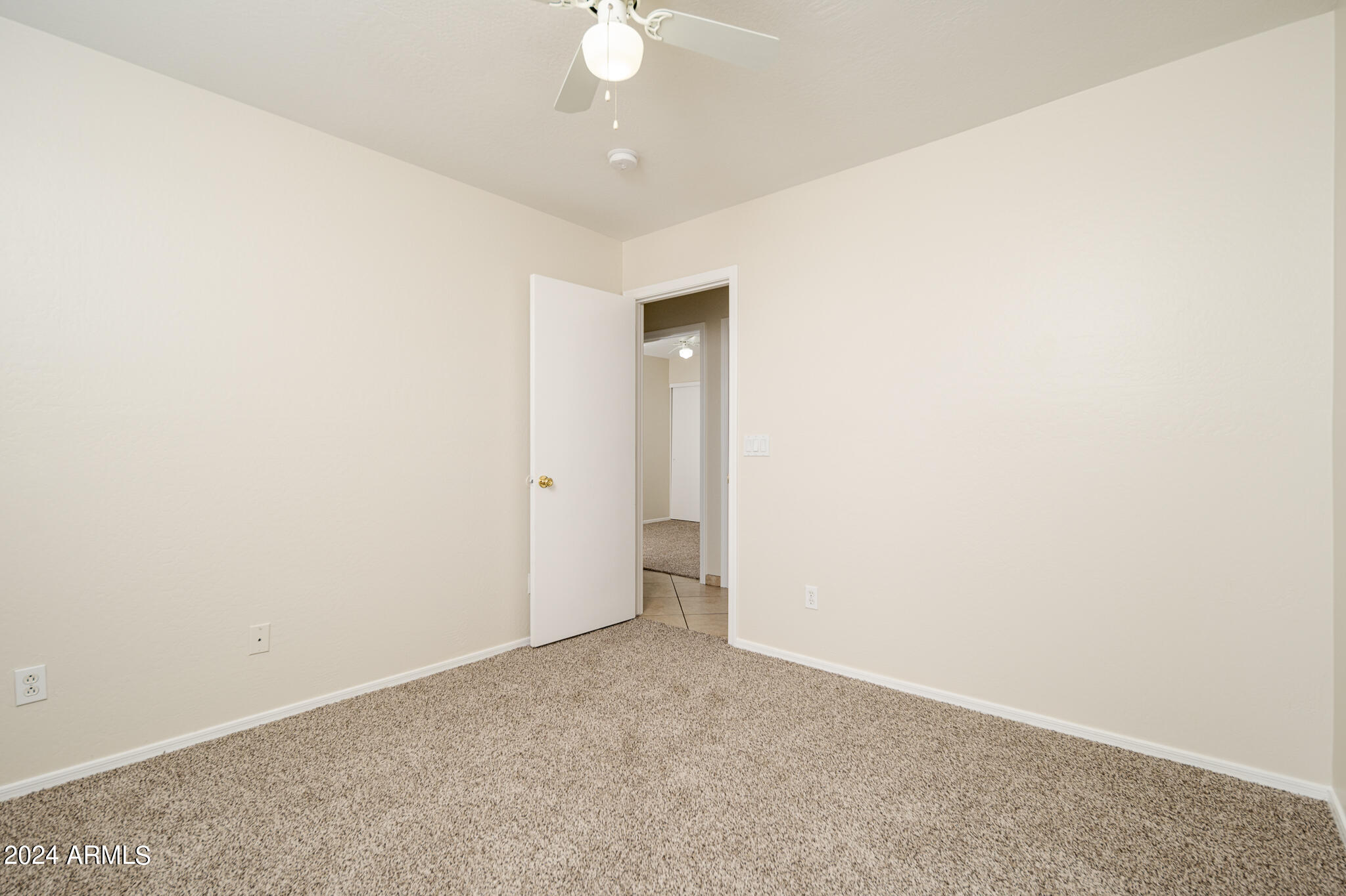 7208 West Crown King Road Phoenix, AZ 85043 - Photo 19 of 42 an empty room with a fan