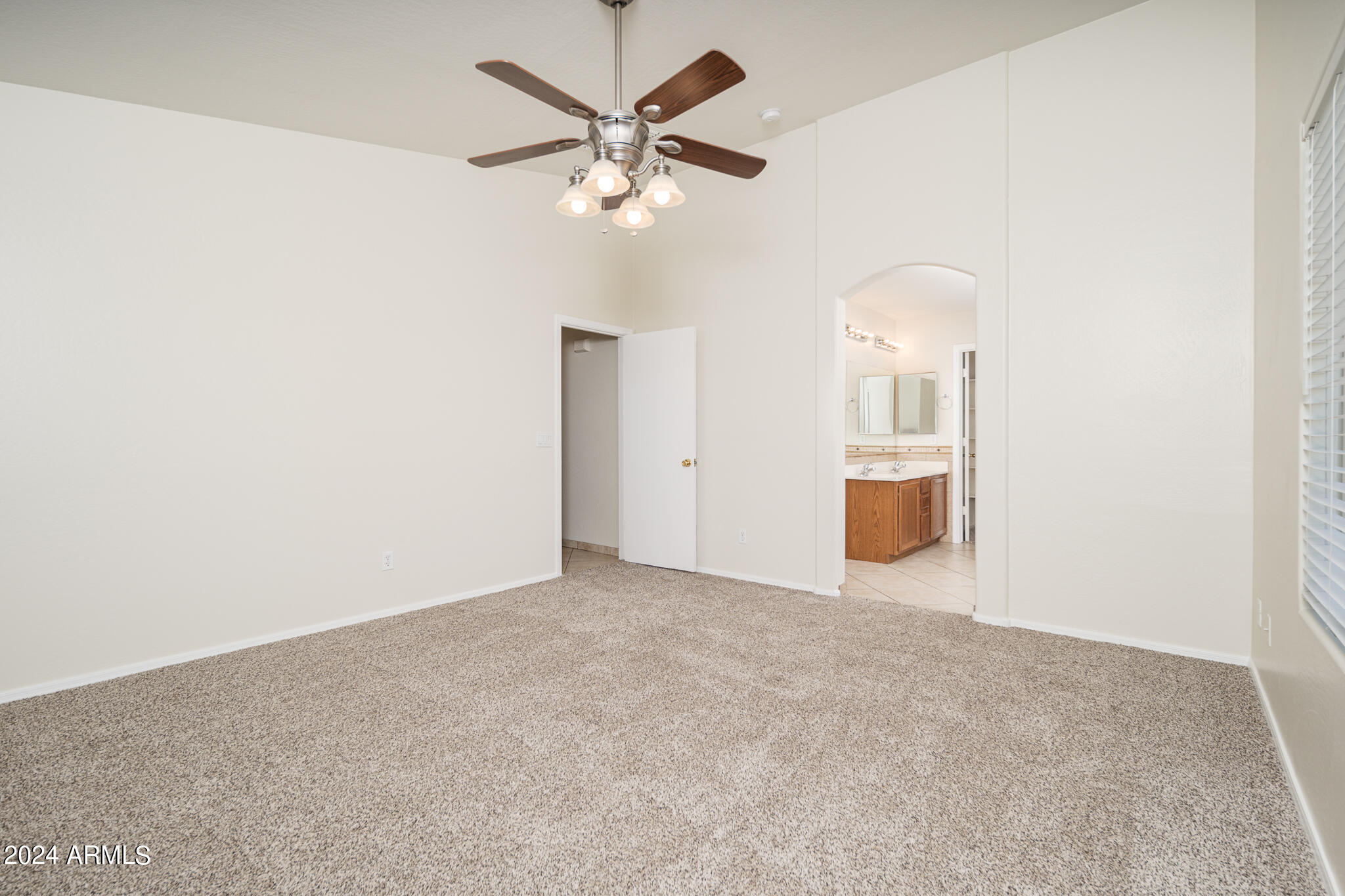 7208 West Crown King Road Phoenix, AZ 85043 - Photo 22 of 42 an empty room with a ceiling fan