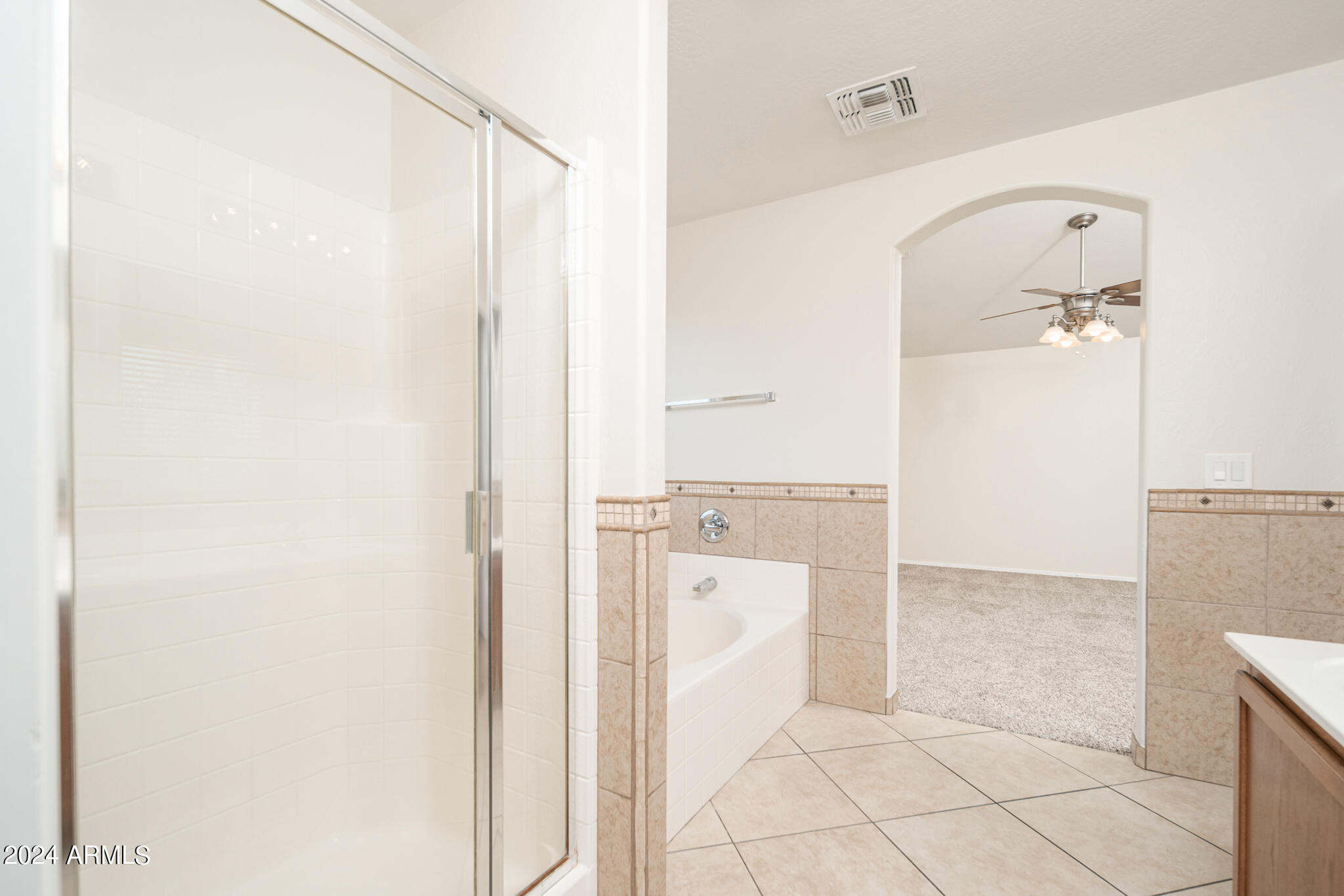 7208 West Crown King Road Phoenix, AZ 85043 - Photo 24 of 42 a bathroom with a shower and a glass door
