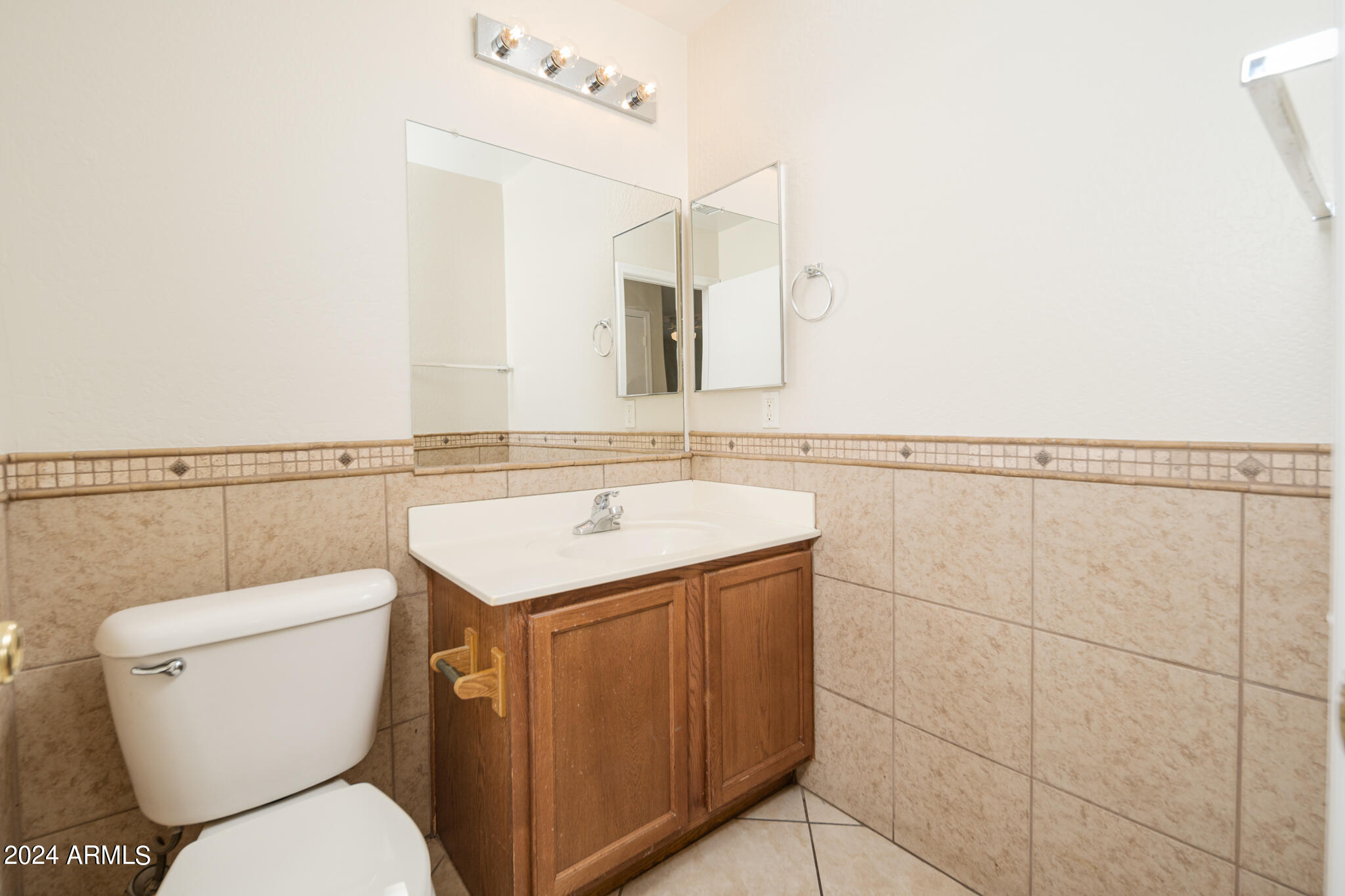 7208 West Crown King Road Phoenix, AZ 85043 - Photo 26 of 42 a bathroom with a toilet sink and mirror