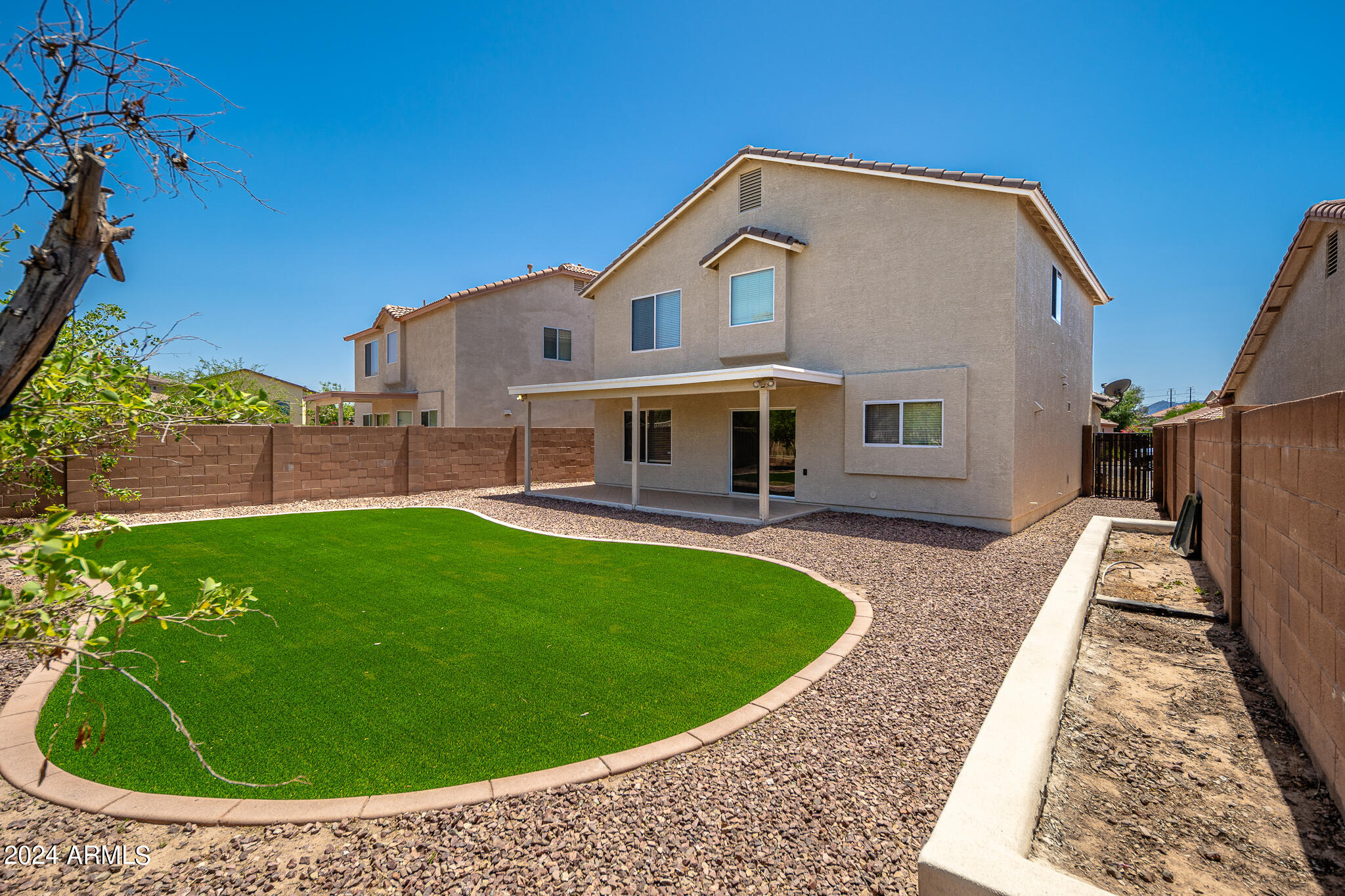 7208 West Crown King Road Phoenix, AZ 85043 - Photo 29 of 42 a view of a house with a backyard