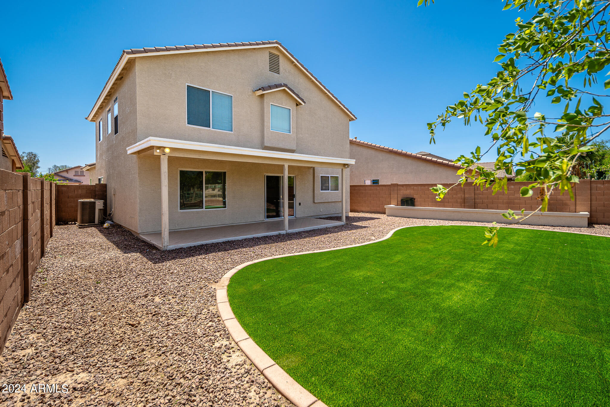 7208 West Crown King Road Phoenix, AZ 85043 - Photo 31 of 42 a front view of a house with garden
