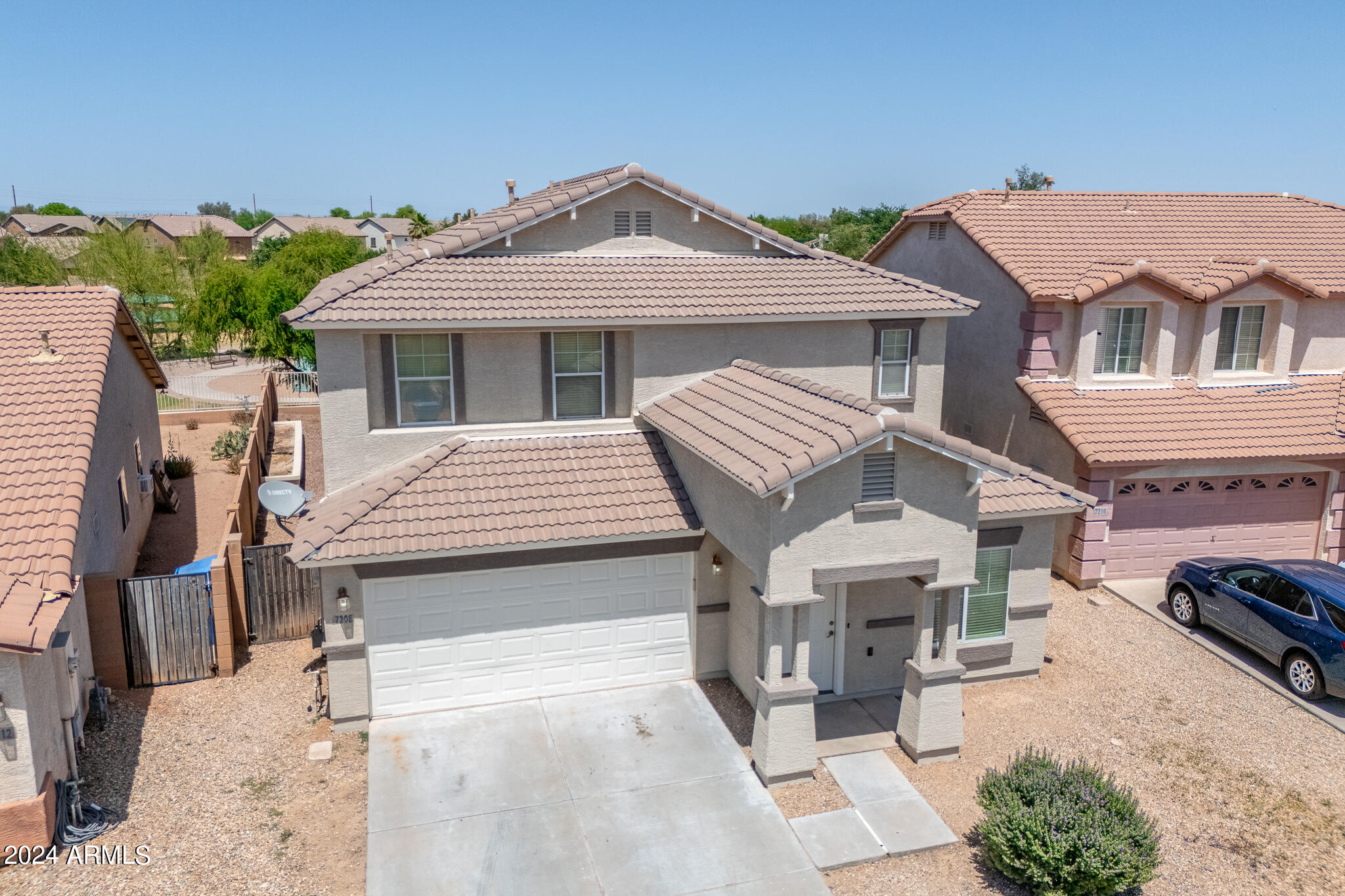 7208 West Crown King Road Phoenix, AZ 85043 - Photo 36 of 42 a front view of a house with a wooden fence
