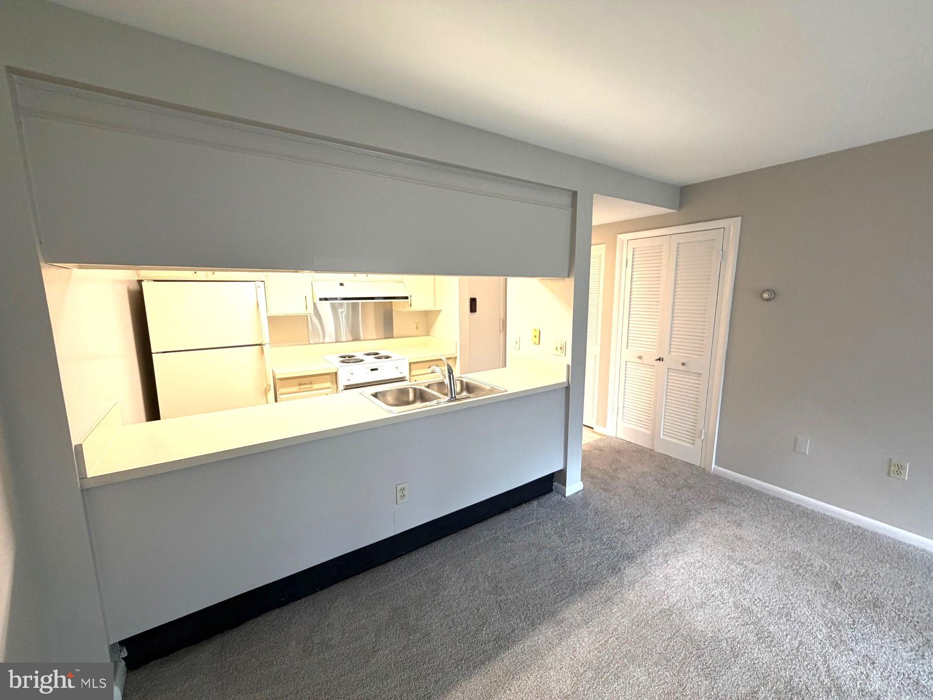 3320 Chiswick Court, Unit 611D Silver Spring, MD 20906 - Photo 12 of 38 a living room with a large window