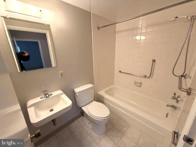 3320 Chiswick Court, Unit 611D Silver Spring, MD 20906 - Photo 21 of 38 a bathroom with a toilet a sink and a mirror