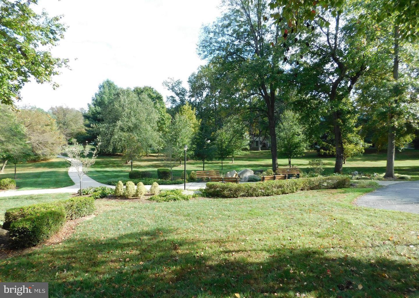 3320 Chiswick Court, Unit 611D Silver Spring, MD 20906 - Photo 5 of 38 a view of a park with large trees