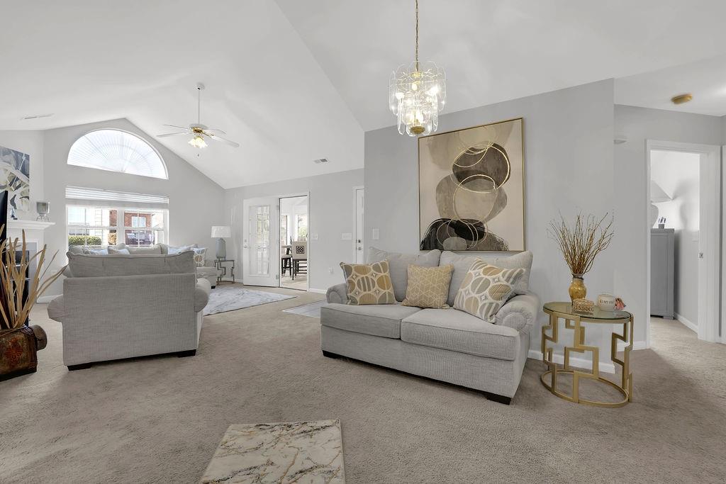 3057 Orchard Ridge Circle Duluth, GA 30096 - Photo 13 of 37 a living room with furniture and a chandelier