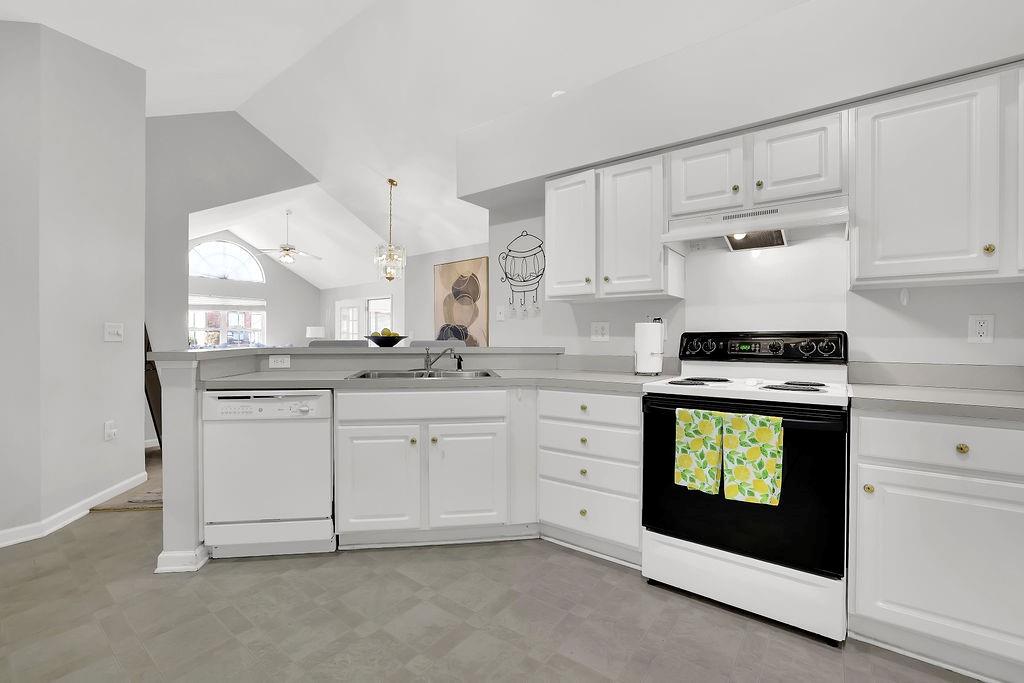 3057 Orchard Ridge Circle Duluth, GA 30096 - Photo 16 of 37 a kitchen with granite countertop white cabinets and white appliances