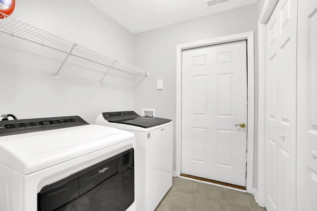 3057 Orchard Ridge Circle Duluth, GA 30096 - Photo 18 of 37 a utility room with dryer and washer