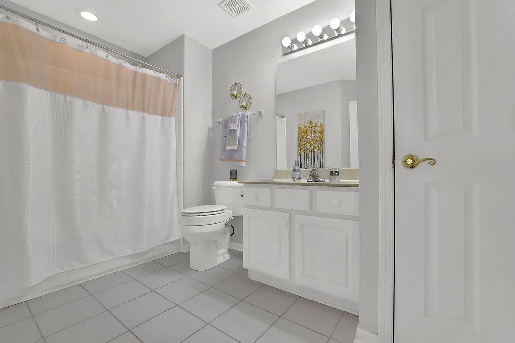 3057 Orchard Ridge Circle Duluth, GA 30096 - Photo 23 of 37 a bathroom with a sink a toilet and a mirror