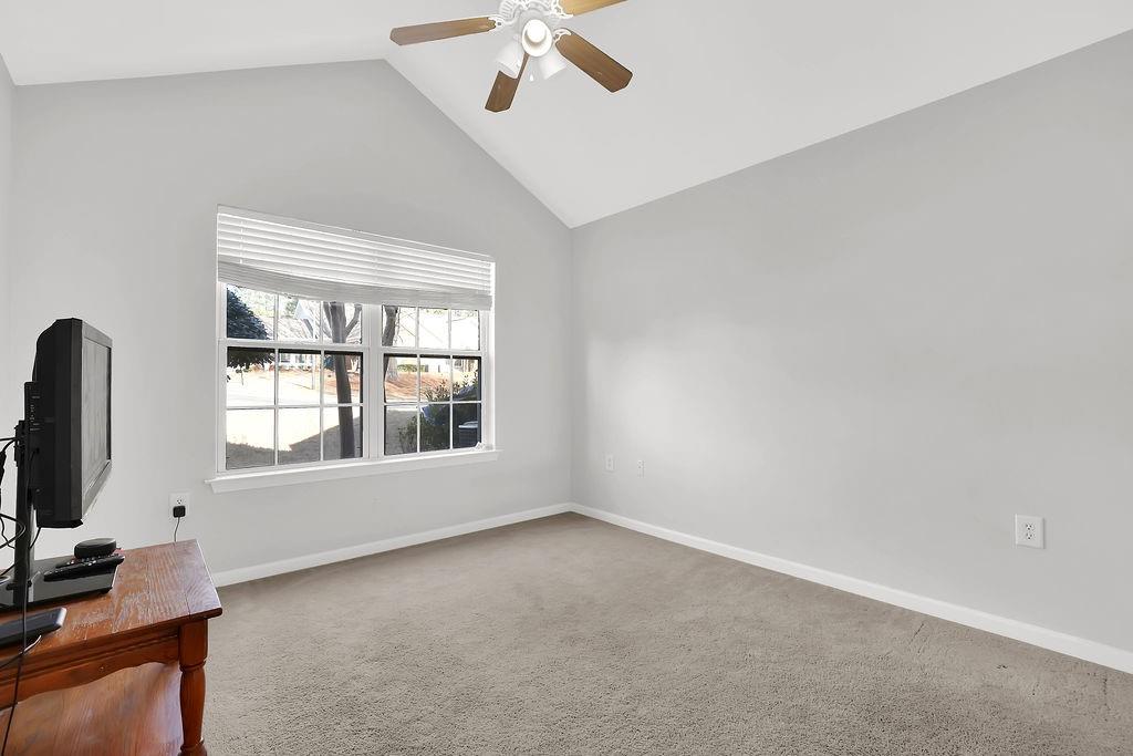 3057 Orchard Ridge Circle Duluth, GA 30096 - Photo 24 of 37 an empty room with a window and a flat screen tv