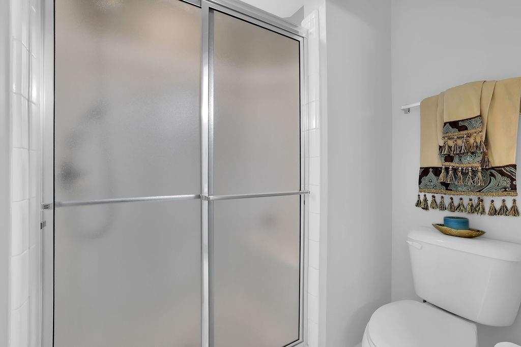 3057 Orchard Ridge Circle Duluth, GA 30096 - Photo 31 of 37 a bathroom with a toilet and a shower