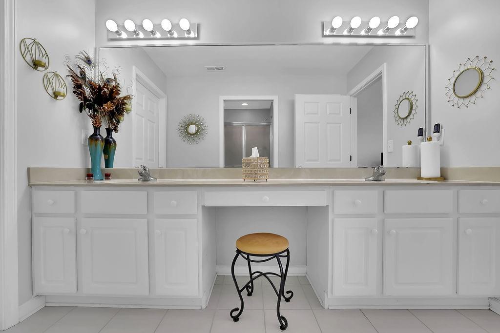 3057 Orchard Ridge Circle Duluth, GA 30096 - Photo 32 of 37 a bathroom with a sink and a mirror
