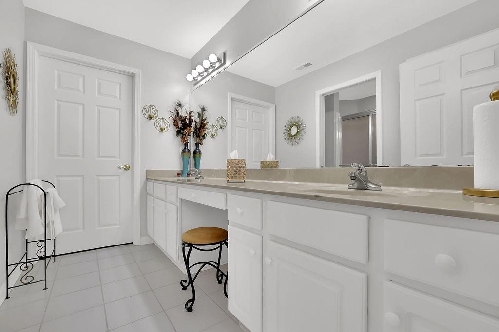 3057 Orchard Ridge Circle Duluth, GA 30096 - Photo 33 of 37 a bathroom with a sink and a mirror