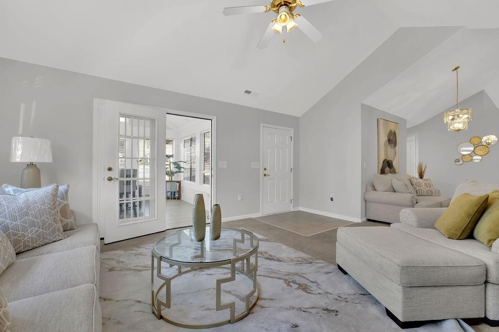 3057 Orchard Ridge Circle Duluth, GA 30096 - Photo 9 of 37 a living room with furniture and a chandelier