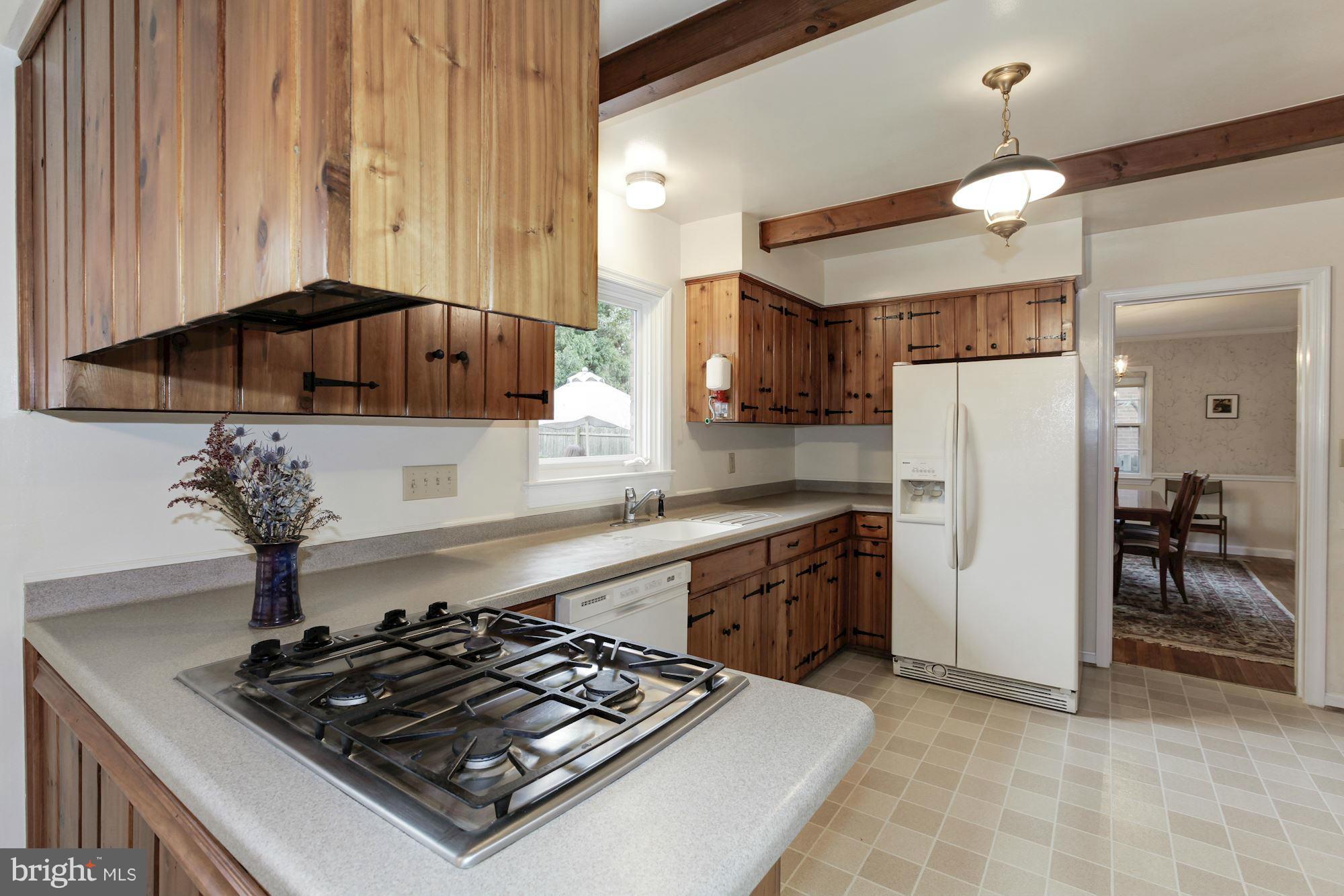 5502 Pollard Road Bethesda, MD 20816 - Photo 12 of 30 a kitchen with a stove and a refrigerator