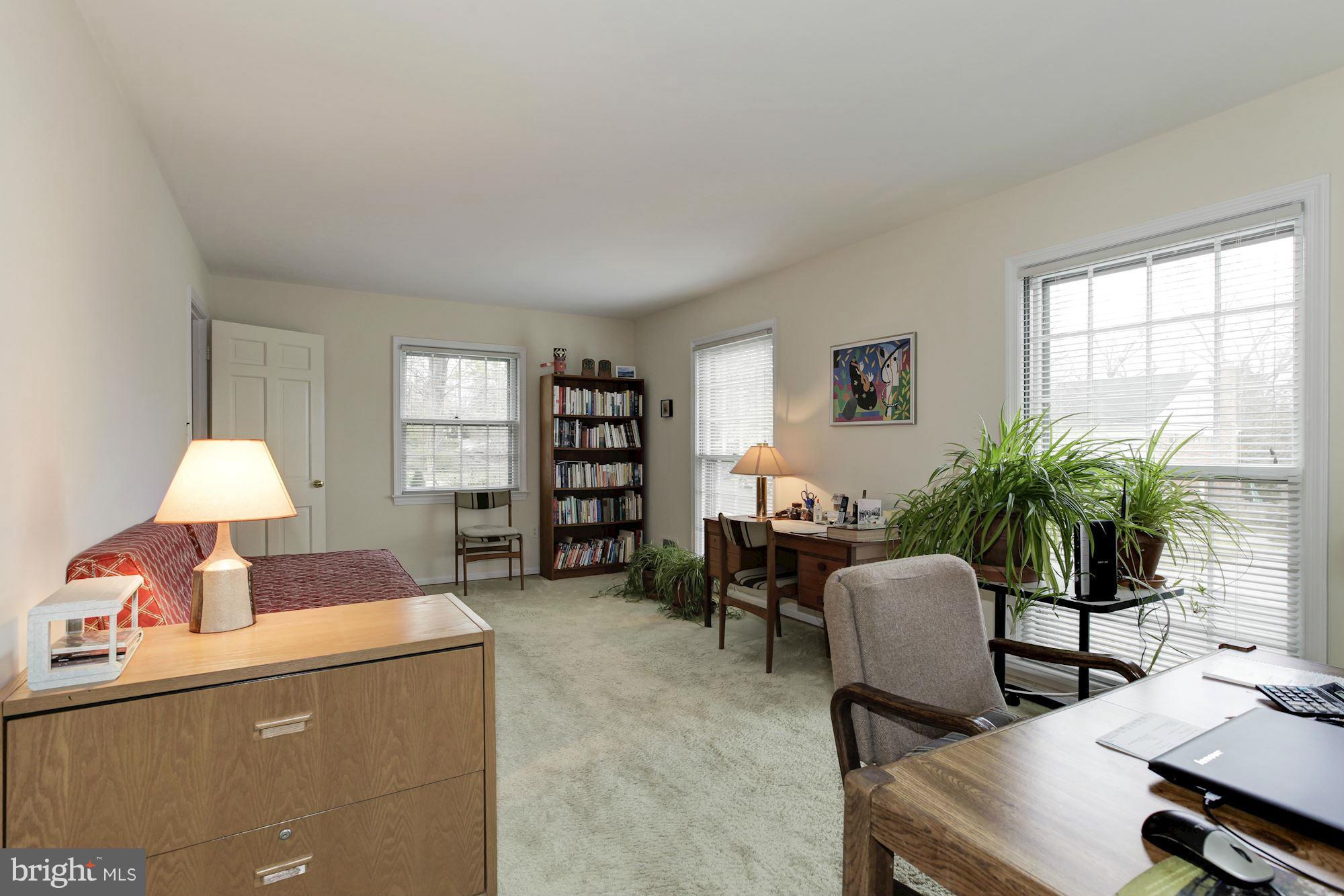 5502 Pollard Road Bethesda, MD 20816 - Photo 16 of 30 a living room with furniture and a potted plant
