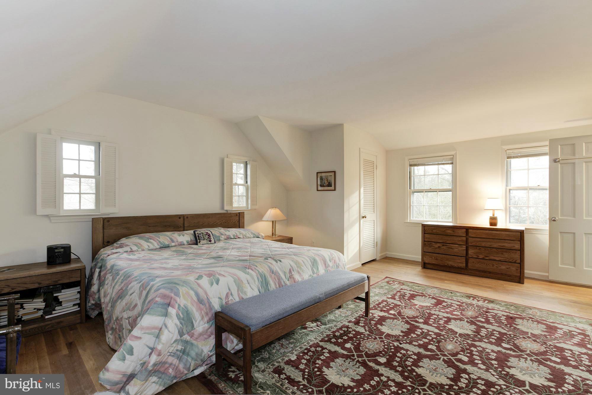 5502 Pollard Road Bethesda, MD 20816 - Photo 20 of 30 a bedroom with a bed and wooden floor