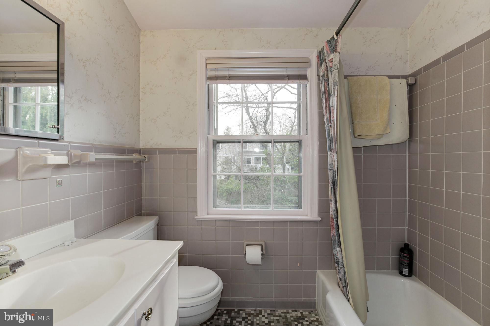 5502 Pollard Road Bethesda, MD 20816 - Photo 23 of 30 a bathroom with a sink toilet and shower